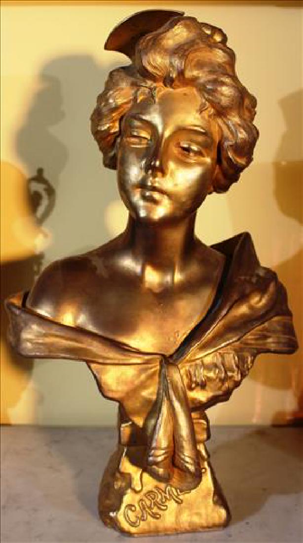 Metal bust of woman painted gold, 16T