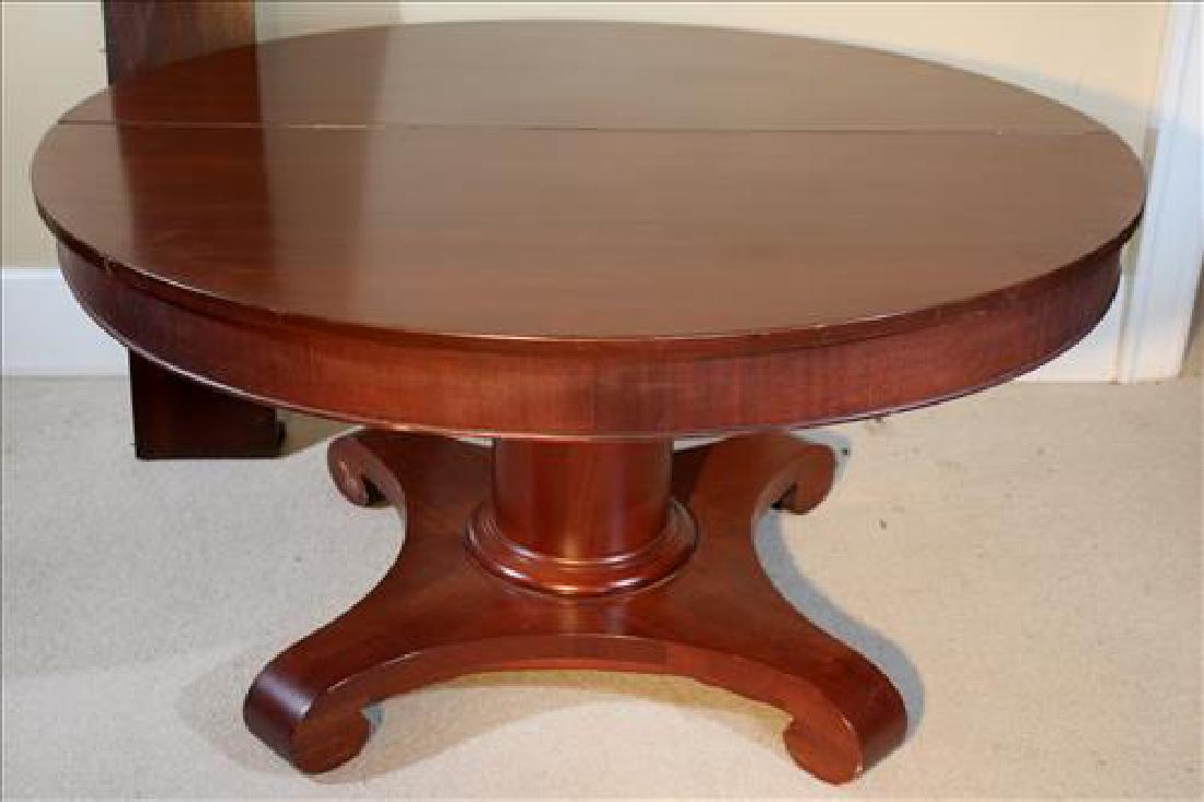 Mahogany Empire dining table with scroll feet