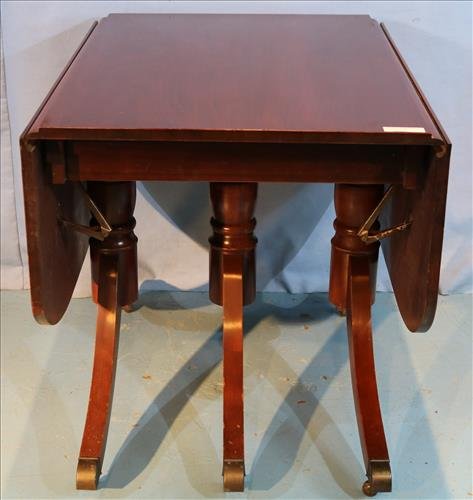 Mahogany Duncan Phyfe dining table: Mahogany Duncan Phyfe dining table with 3 pedestals and drop leaf, 30 in. T, 28 in. W, 39 in. D.