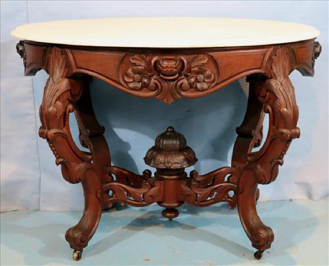 Ornately carved walnut Victorian oval table (1 of 6)