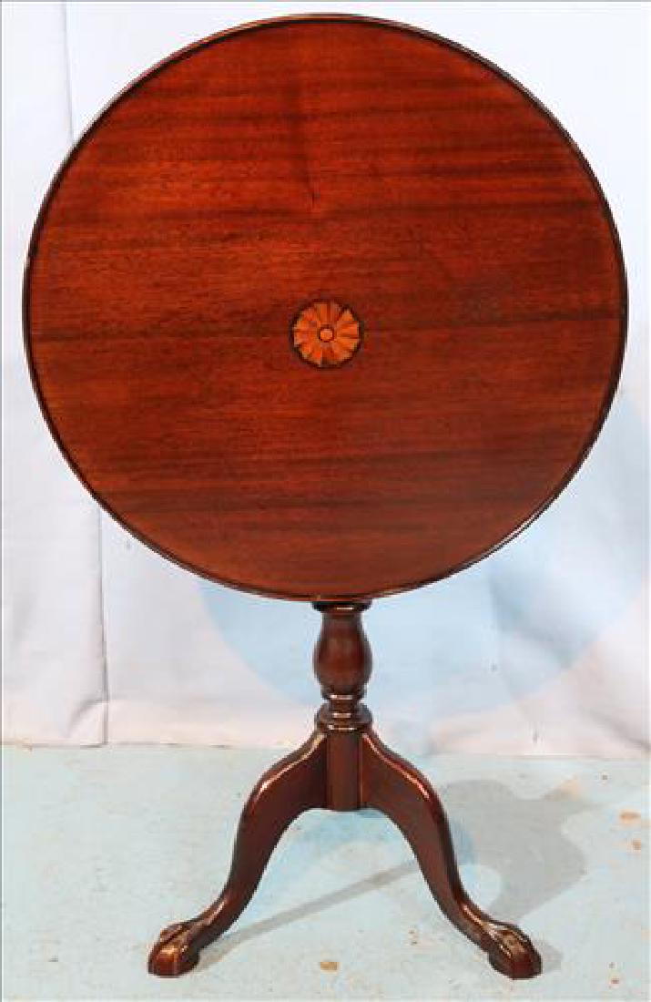 Mahogany tilt top table with inlaid top: Mahogany tilt top table with inlaid top, 28.5 in. T, 24 in. R.