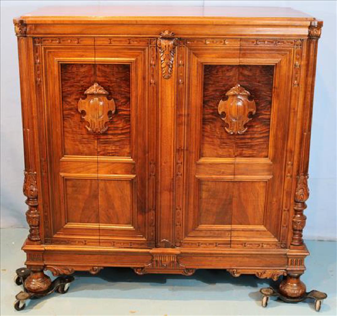 Walnut liquor bar with lazy susan: Walnut liquor bar with lazy susan bottle holder on one side and double door storage on the other, made from old piece, 48 in. T, 49 in. W, 25 in. D.