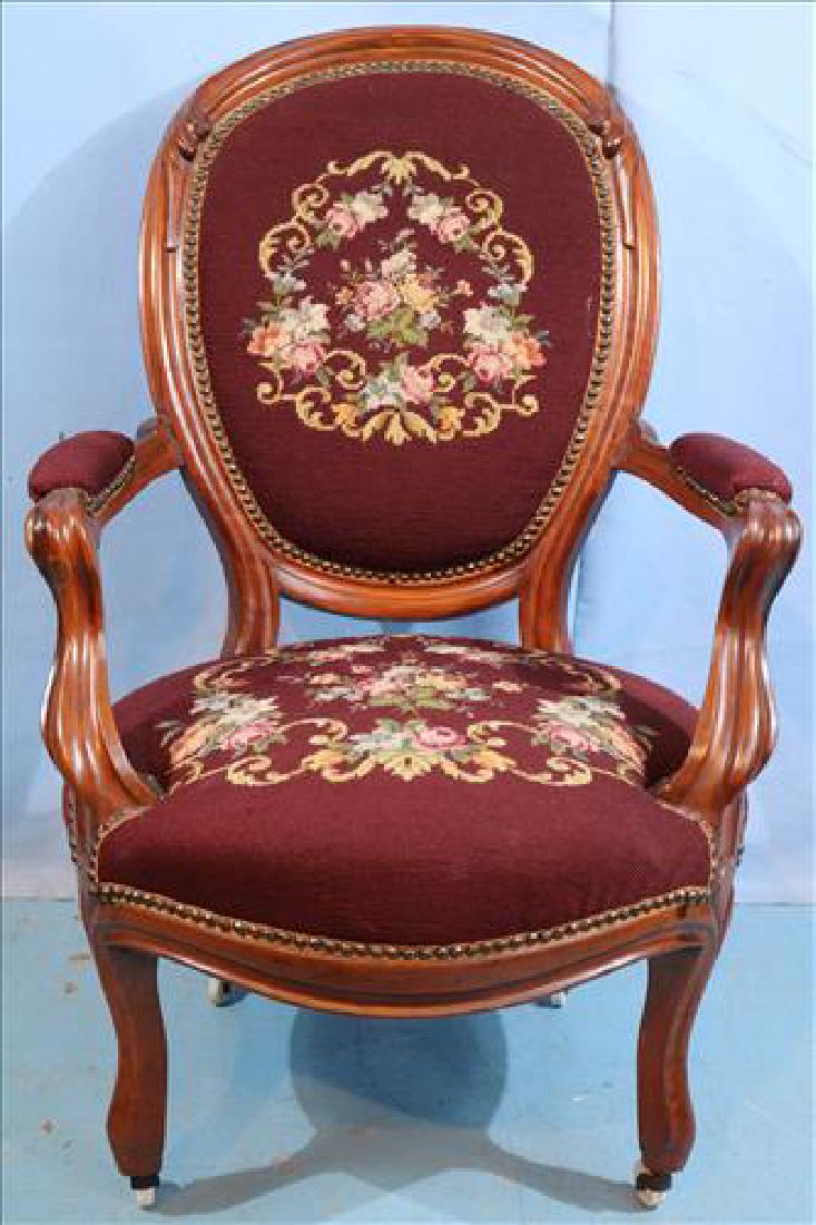 Walnut Victorian finger carved arm chair w needlepoint