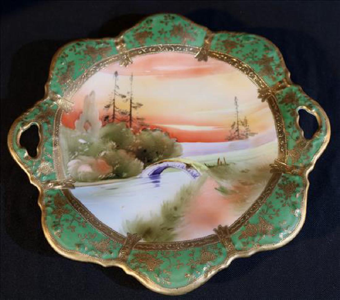 H.P. Nippon heavily decorated tray with bridge scene: H.P. Nippon heavily decorated tray with bridge scene, green and gold 11 in. Dia.