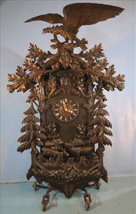 Giant Black Forest coo coo clock, 8 ft. 7 in. T.: Giant black forest coo coo clock with deer, trees and giant eagle on top, 8 ft. 7 in. T, 5 ft. W, 22 in. D.