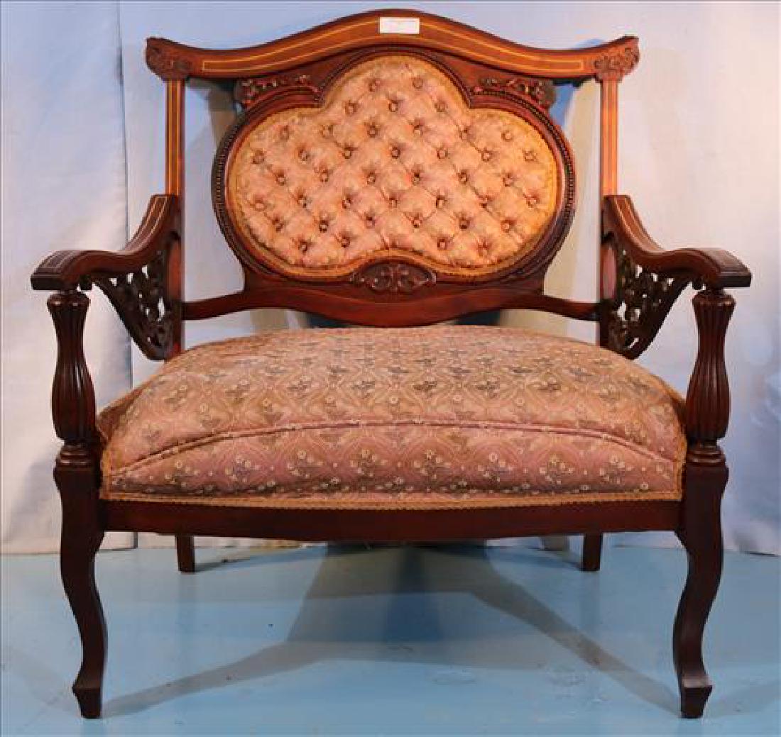 Late Victorian mahogany loveseat, pink upholstery: Late Victorian mahogany loveseat with pink upholstery and fret work in good condition, 40 in. T, 33 in. W, 22 in. D.