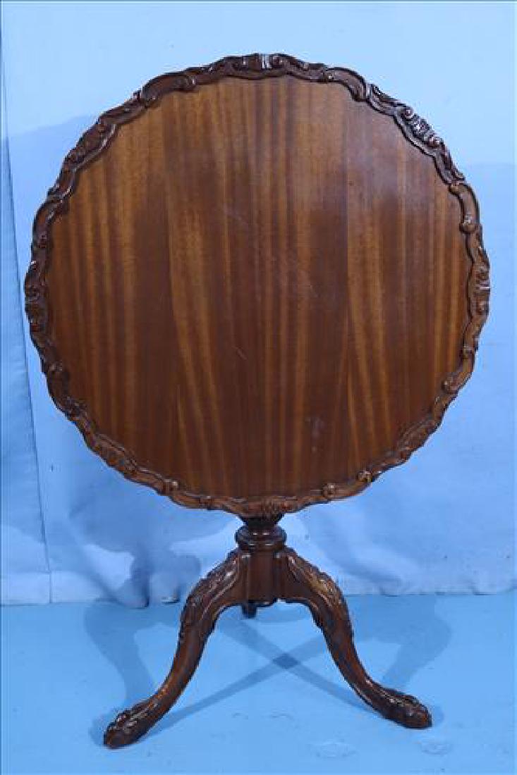 Mahogany pie crust tilt-top table w carving on legs (1 of 4)