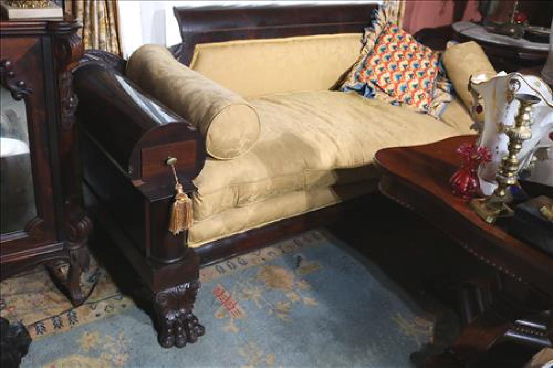 Empire mahogany sofa with glove boxes in each arm: Empire mahogany sofa with glove boxes in each arm, claw feet, gold upholstery and goose down cushions, 34 in. T, 77 in. W, 23 in. D.