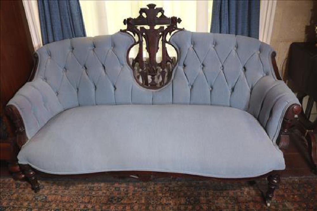Walnut Victorian small sofa with open pierced back: Walnut Victorian small sofa with open pierced carved back and light blue upholstery, 40 in T, 66 in. L, 13 in. D.