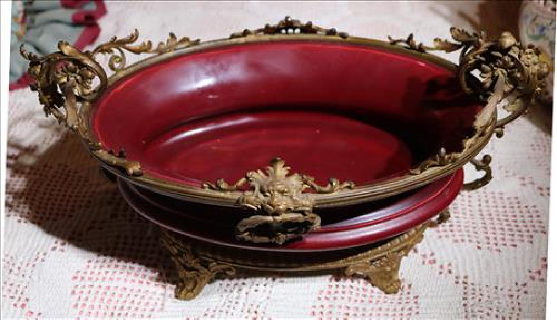 Porcelain center bowl with bronze mounts: Porcelain center bowl with bronze mounts, 14 in L, 9 in. D, 7 in. T.