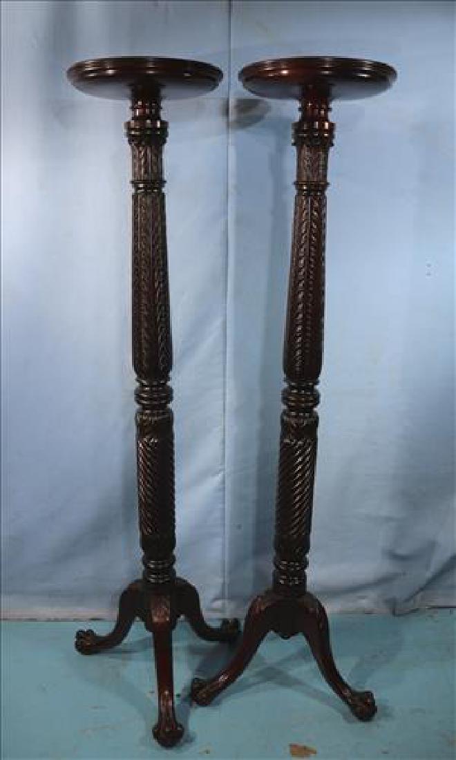 Pair of mahogany torchieres, 62 in. T.: Pair of mahogany torchieres with ball and claw feet and original finish, 62 in. T, 13 in. Dia.