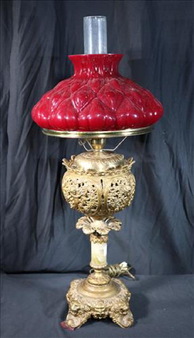 Victorian banquet lamp with onyx and brass base: Victorian banquet lamp with onyx and brass base and 10 in. ruby shade, 29 in. T,