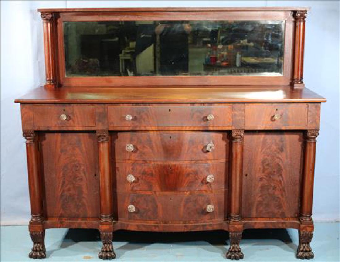 Mahogany Empire sideboard with claw feet: Mahogany Empire sideboard with claw feet, columns, mirrored backsplash and glass pulls, 62 in. T, 72 in. W, 24 in. D.