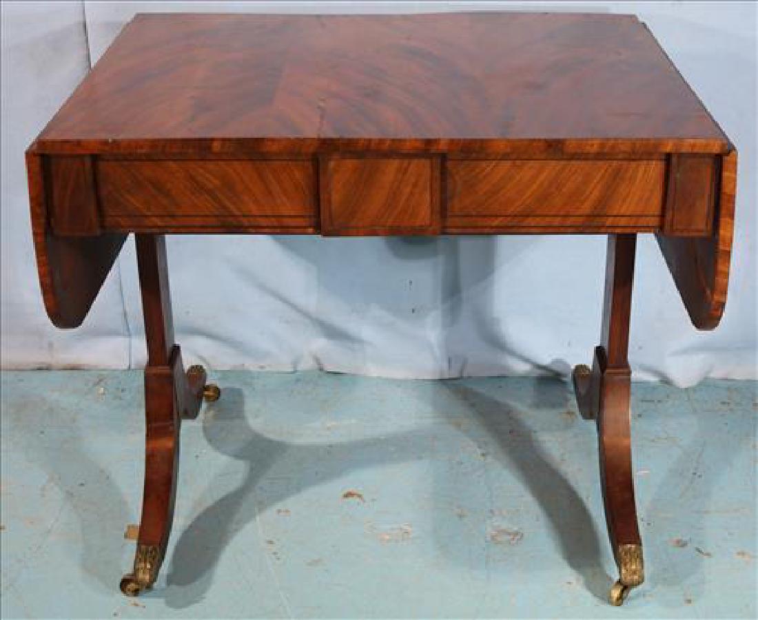 Mahogany regency sofa table with drop leaf: Mahogany regency sofa table with drop leaf, ca. 1810, 29 in. T, 34 in. W, 26 in. D.