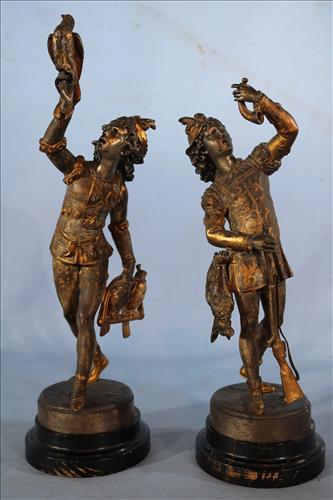 Pair of Metal figural statues of hunters: Pair of metal figural statues of hunters, one has birds and the other a gun, 17 in T.