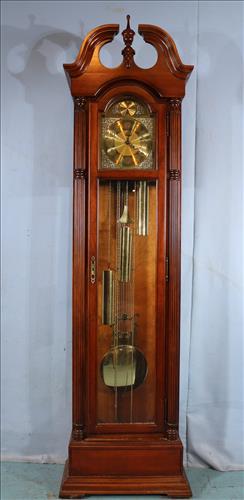Howard Miller mahogany grandfather clock: Howard Miller mahogany grandfather clock, 81 in. T, 22 in. D.
