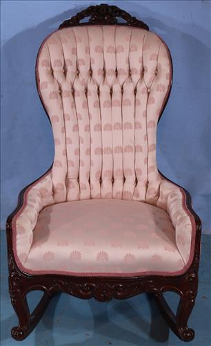 Mahogany rococo beautifully carved rocker: Mahogany rococo beautifully carved rocker with pink upholstery, 44 in T, 26 in. W, 21 in. D.