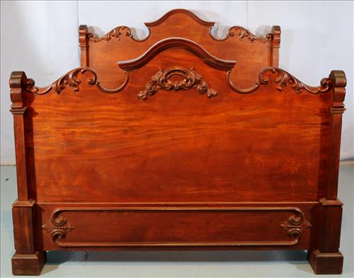 Walnut Victorian bed with high footboard: Walnut Victorian bed with high footboard and carved rails, 57 in. T, 73 in. L, 57 in. W.