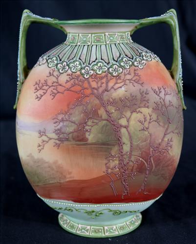 Nippon double handle moriage vase: Nippon double handle moriage vase with fine painting and in excellent condition, 8 in. T, 6 in. W.