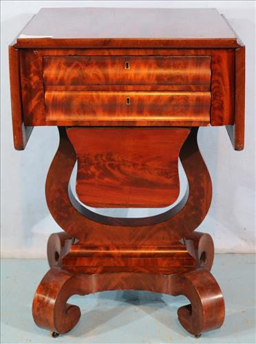 Mahogany Empire drop leaf sewing stand: Mahogany Empire drop leaf sewing stand with thread drawer and scroll feet, 29 in. T, 18 in. W, 18 in. D.
