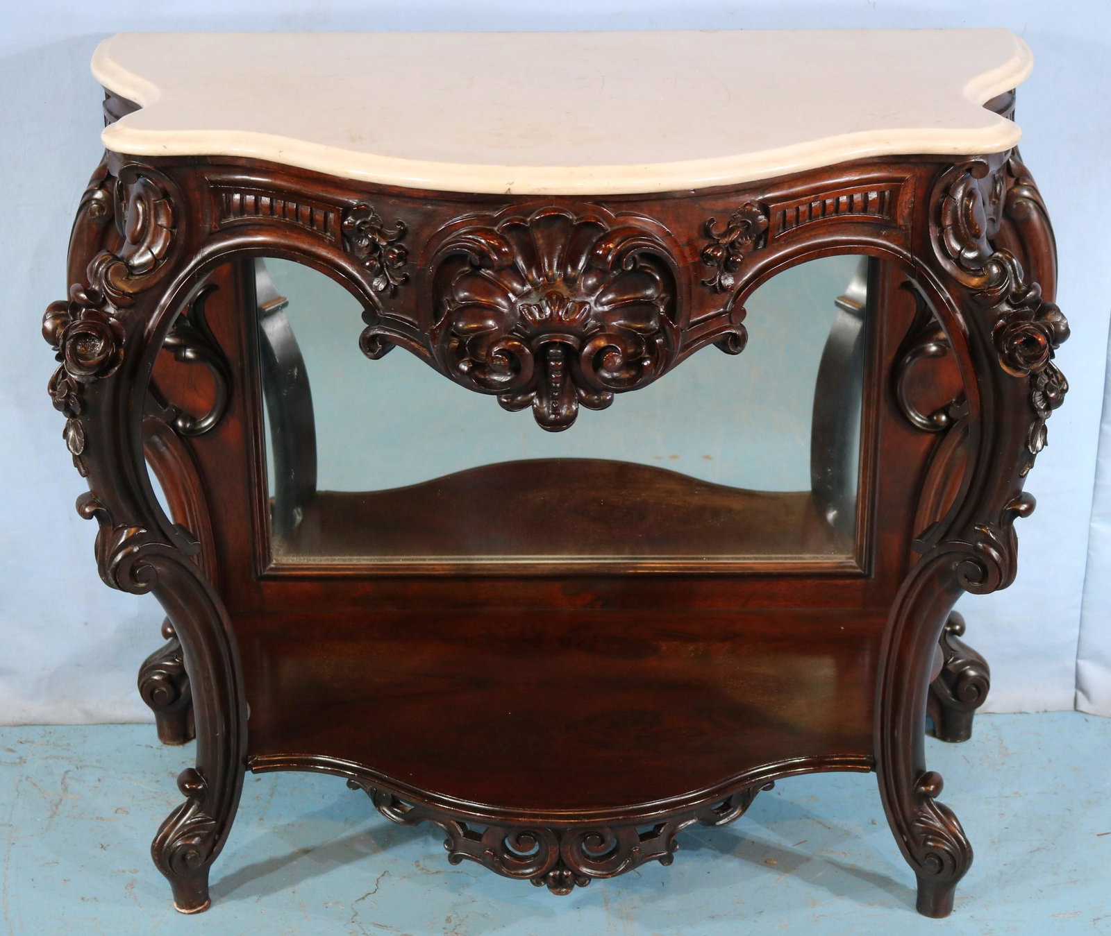Rosewood rococo marble top pier table: Rosewood rococo marble top pier table, laminated and beautifully carved attrib. to J.H. Belter, 34 in. T, 45 in. W, 21 in. D.