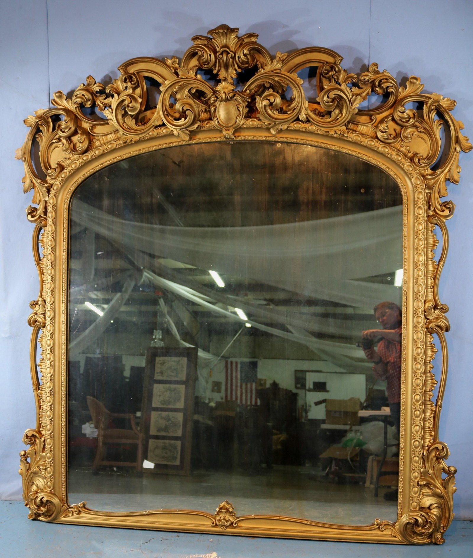 Large rococo gold gilded mantle mirror: Large rococo gold gilded mantle mirror in great condition, 80 in. T, 76 in. W.
