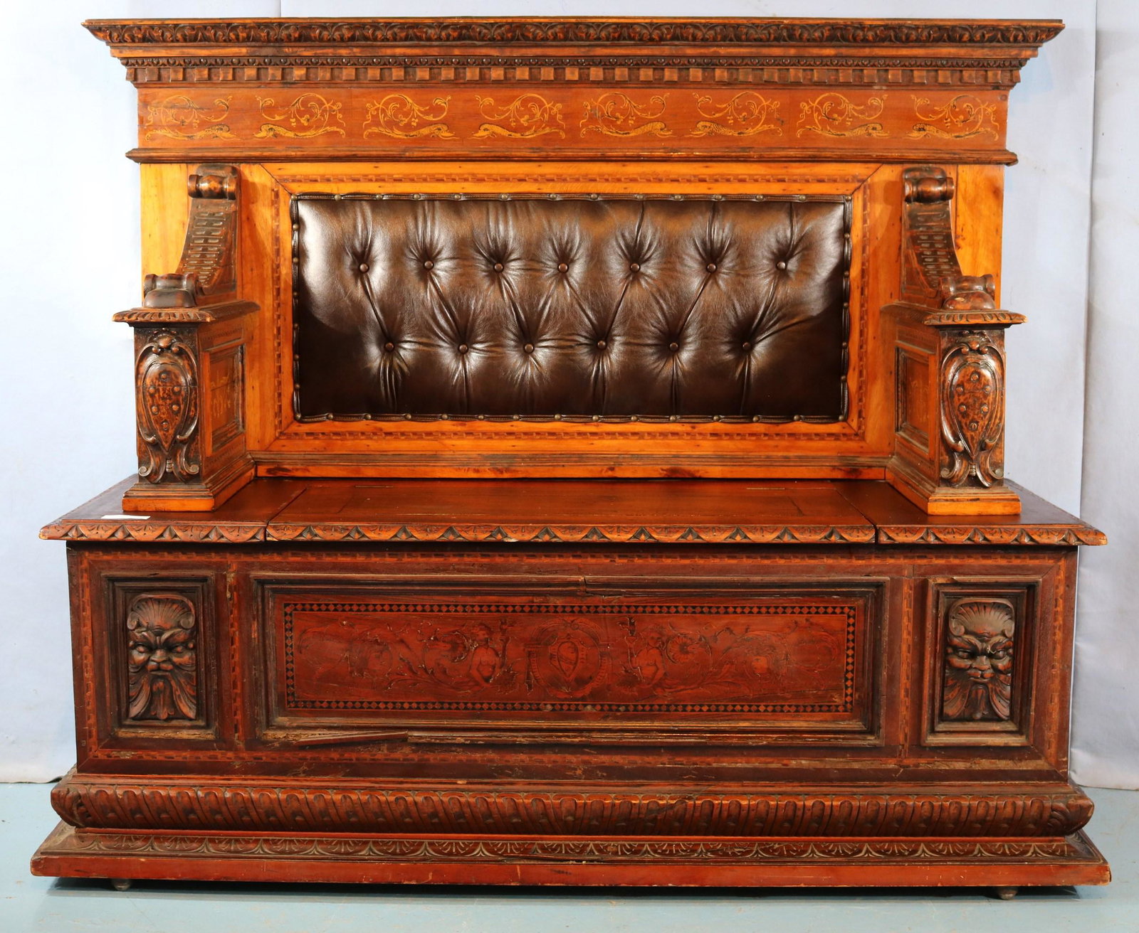 Mahogany hall seat with inlay and carving: Mahogany hall seat with inlay and carving, lift seat and leather back, 51 in. T, 80 in. W, 22 in. D.