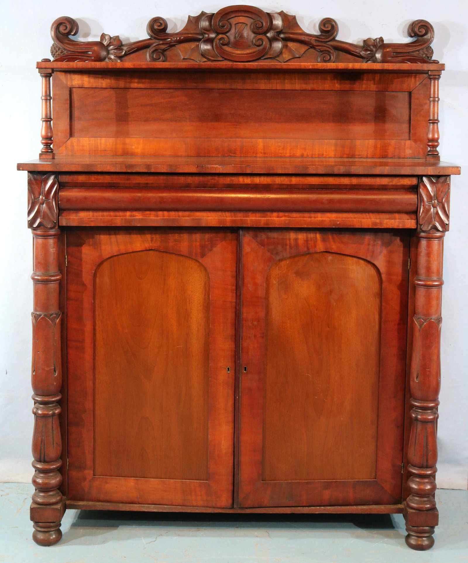English mahogany server with drawer: English mahogany server with drawer, 2 doors at bottom and carved backsplash, 58 in. T, 40 in. W, 16 in. D.