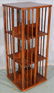 Oak revolving bookcase on stand, 43 in. T, 17 in. Sq.