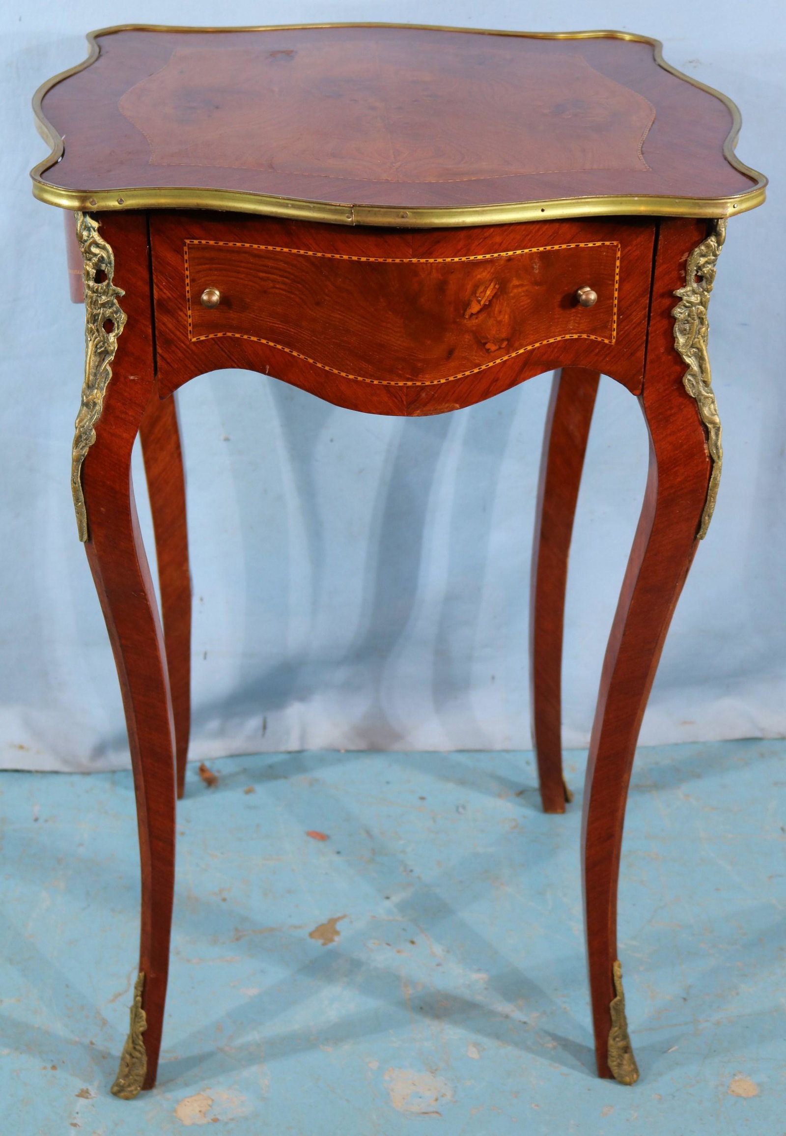 Small mahogany French lamp table: Small mahogany French lamp table with drawer and brass trim, 31 in. T, 21 in. Sq.