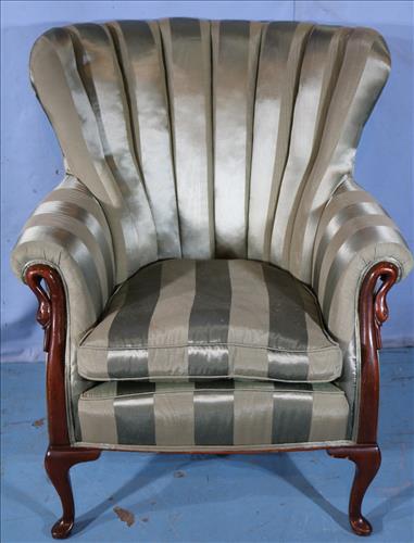 Mahogany wing back parlor chair with goose neck: Mahogany wing back parlor chair with goose neck arms and green striped upholstery, 37 in T, 31 in. W.