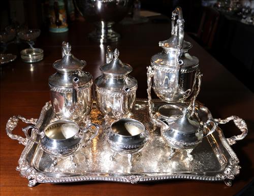 7 piece silver-plate tea service: 7 piece silver-plate tea service with tilt pot and large tray, 3 in. T, 28.5 in. L, 17 in. D.
