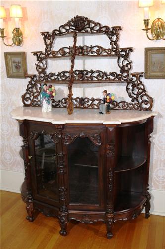 Rosewood rococo parlor etagere: Rosewood rococo parlor etagere with white cut marble top and carved all over, marble has one spot damage, 52 in. W, 70 in. T, 22.52 in. D.