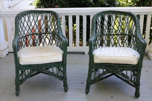 Bar Harbor antique green wicker chairs: Bar Harbor antique green wicker chairs with white cushions, 33 in. T, 23 in. W, 20 in. D.