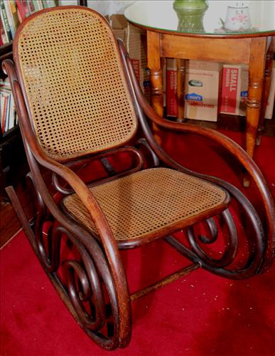 Bentwood rocker with lace cane back: Bentwood rocker with lace cane back, 33.5 in. T, 20 in. W, 18 in. D.