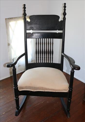 Oak spindle back rocker painted black: Oak spindle back rocker painted black, 42 in. T, 26.5 in. W, 19 in. D.