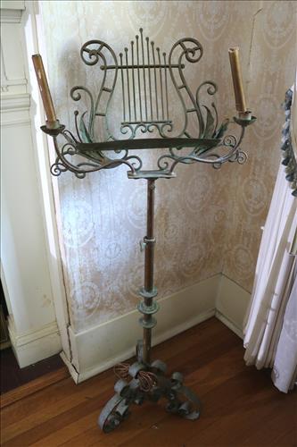 Victorian sheet music stand of cast iron and brass: Victorian sheet music stand made of cast iron and brass, 51 in. T, 20.5 in. W, 14 in. D.