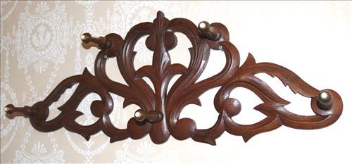 Walnut Victorian pierced carved hat rack: Walnut Victorian pierced carved hat rack, 10 in. T, 25.5 in. W.
