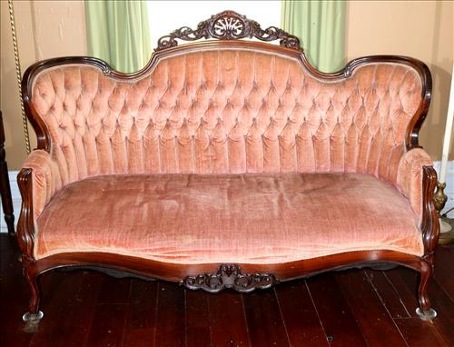 Rosewood rococo parlor sofa: Rosewood rococo parlor sofa with burnt orange upholstery, 42 in. T, 23 in. D, 65 in. W.