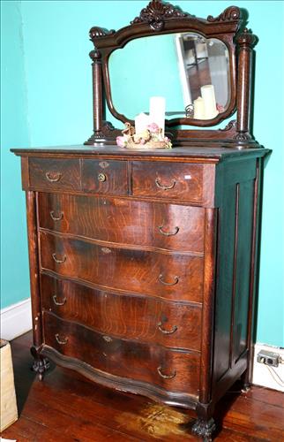 Oak serpentine and column front highboy: Oak serpentine and column front highboy with 7 drawers and mirror, 78 in. T, 46 in. W, 20 in. D.