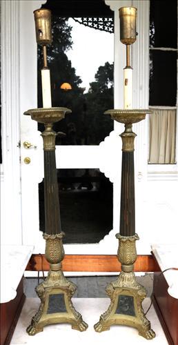 Pair of brass pole lamps with angel faces: Pair of brass pole lamps with angel faces, needs shades, 48 in. T.