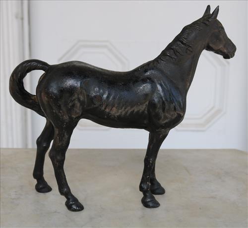 Cast iron horse door stop, 10.5 in. T, 12 in. W.: Cast iron horse door stop, 10.5 in. T, 12 in. W.