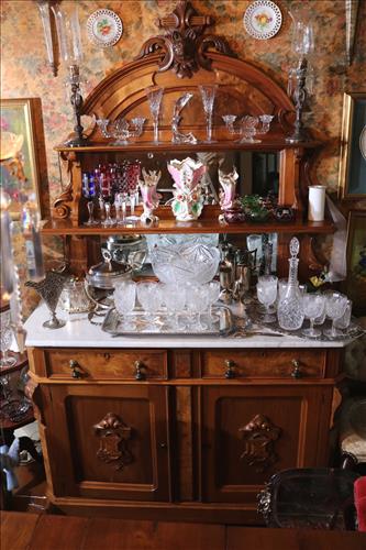 Walnut Victorian sideboard with marble top: Walnut Victorian sideboard with white marble top and fox head on crown, 93 in. T, 57 in. W, 24 in. D.