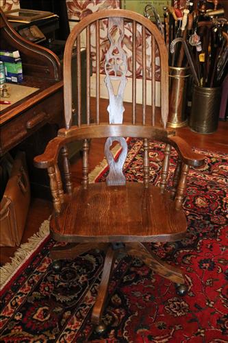 Windsor style oak desk chair: Windsor style oak desk chair from Tom's Desk, 43 in .T, 23 in. W, 18 in. D.