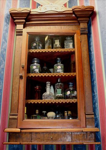 Walnut Eastlake Victorian corner medicine cabinet: Walnut Eastlake Victorian corner medicine cabinet, 35 in. T, 20.5 in. W, 6.5 in. D.