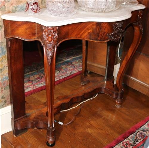 Walnut Victorian console table with marble top: Walnut Victorian console table with marble top and mirror back, 35 in. T, 44 in. W, 17.5 in. D.