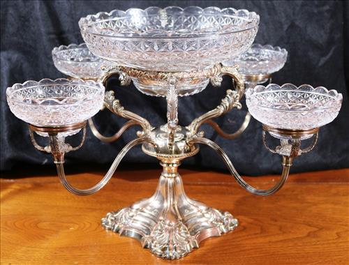 Victorian silver over copper epergne: Victorian silver over copper epergne with cut glass bowls, 16 in. W, 12 in. T.