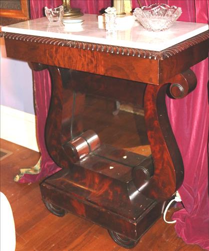 Mahogany Empire pier table with white marble: Mahogany Empire pier table with white marble and mirror back, 36 in. T, 32 in. W, 17 in. D.