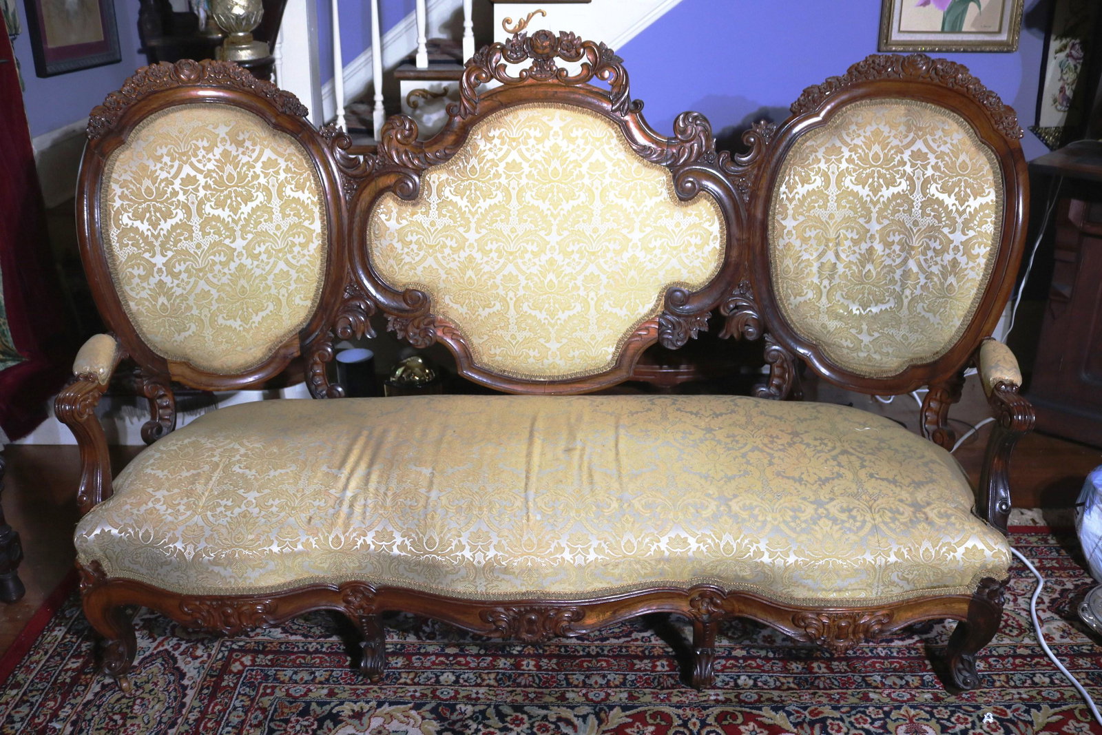 Rosewood rococo triple back sofa: Rosewood rococo triple back sofa with gold upholstery, 35 in. T, 68 in. W, 30 in. D.