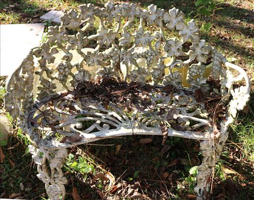 White antique cast iron yard bench: White antique cast iron yard bench, 27 in. T, 34 I n. W, 17 in. D.